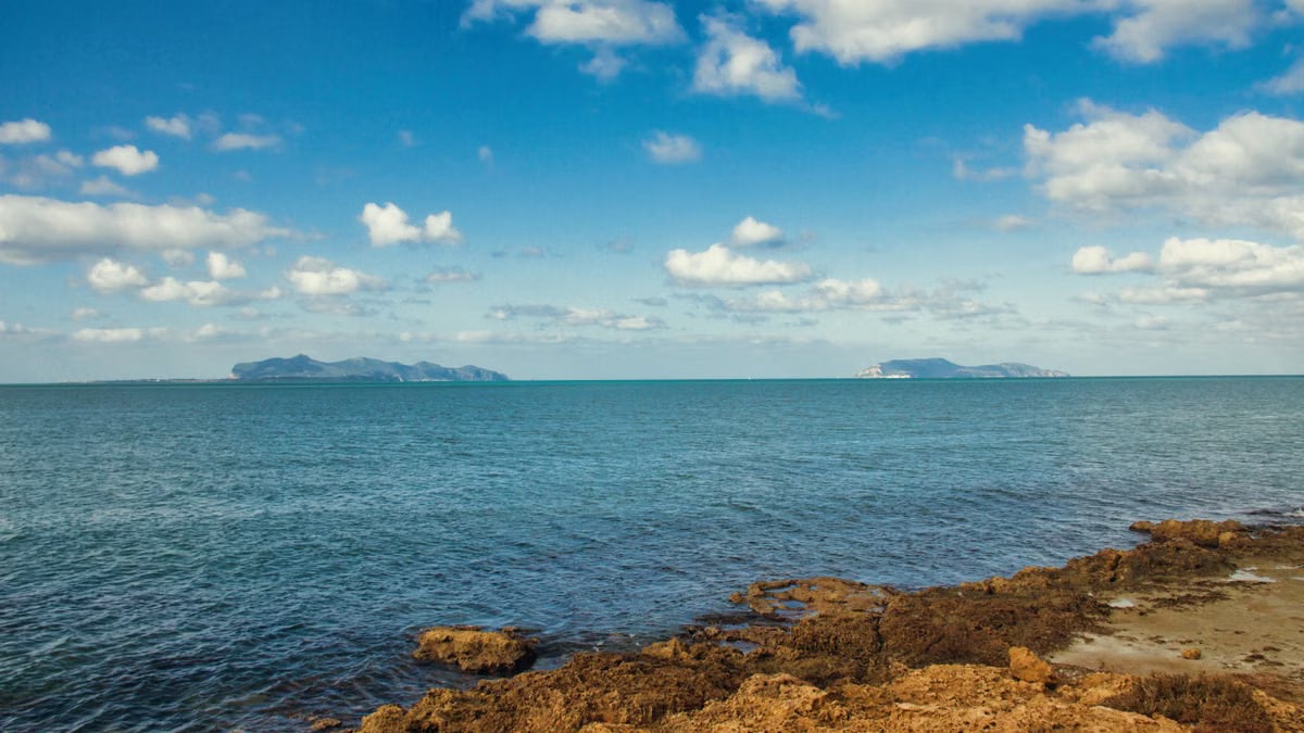 Stunning seascape of the Trapani coastline in Sicily under clear blue skies.